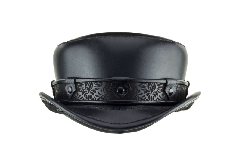 May include: A black leather fedora hat with a decorative embossed band.