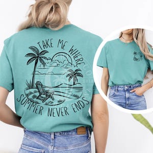 May include: A teal blue t-shirt with a black graphic design on the back. The graphic features a beach scene with palm trees, a beach chair, and the text "Take Me Where Summer Never Ends".