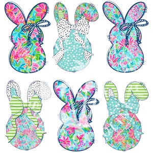 May include: Six Easter bunny cutouts with floral patterns in pink, blue, and green. Each bunny has a bow with polka dots or stripes. The bunnies are outlined in black and are perfect for Easter decorations.