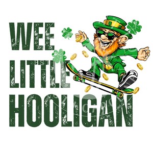 May include: Wee Little Hooligan text with a cartoon image of a leprechaun wearing sunglasses and a green hat skateboarding. The leprechaun is holding a gold coin in one hand and has a green beard. There are gold coins and shamrocks scattered around the leprechaun.