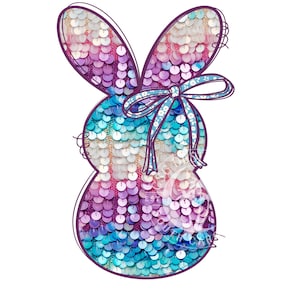May include: A colorful, iridescent Easter bunny shaped sequin patch with a blue bow. The sequins are arranged in a pattern of pink, purple, blue, and white.