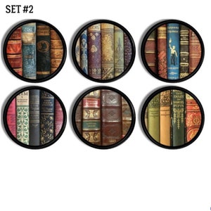 May include: Set of six round coasters featuring a vintage design of book spines. The coasters are black with a gold rim and feature a variety of book titles.