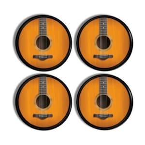 May include: A set of four circular coasters, each featuring a detailed graphic of an acoustic guitar body with a warm amber wood grain finish, a central sound hole, a dark fretboard, and a bridge with six strings, all enclosed in a black rim.