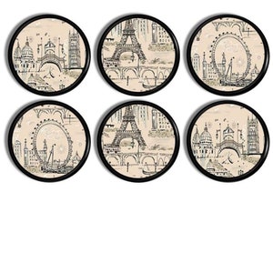 May include: Set of six round coasters with black frames. Each coaster features a different black and white illustration of a famous landmark from Paris and London. The background of each coaster is a light beige colour.