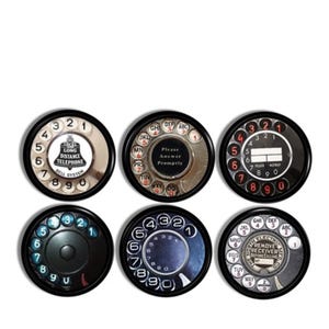 May include: Six vintage rotary phone dial designs with black borders. The dials feature black and white numbers, letters, and text. The text includes "Local Long Distance Telephone Bell System", "Please Answer Promptly", and "Remove Receiver Before Calling".