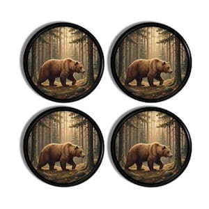 May include: Four round coasters with a black border. Each coaster features a brown bear walking through a forest scene with tall trees and sunlight. The bear is the focal point, set against a backdrop of a forest.
