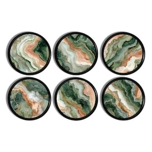 May include: Six round coasters with a black border. Each coaster features a unique swirling pattern in shades of green, peach, and white, resembling natural stone. These coasters are designed to protect surfaces from drink rings.