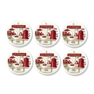 May include: Six round coasters with a kitchen-themed design. Each coaster features a red teapot, white dishes, and a bowl of red flowers. The word "CUISINE" is printed at the top in red on a white background.