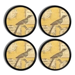 May include: Four circular coasters with black rims. Each coaster displays a brown bird on a branch against a yellow backdrop with vintage script. The bird is brown and the background has a faded, aged appearance.