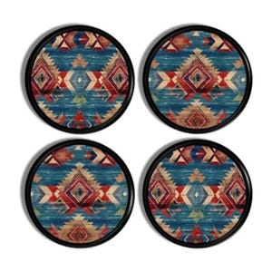 May include: A set of four circular coasters with black rims, each featuring a repeating geometric pattern in shades of blue, red, white, and tan. The design consists of diamond shapes and chevron lines arranged in a symmetrical, layered composition.