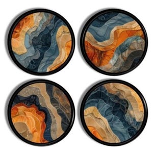 May include: Set of four round wall art prints with abstract designs featuring swirling patterns in shades of blue, orange, and brown. The prints are framed in black.