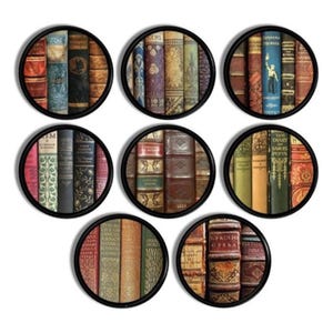 May include: Seven circular wall art prints depicting stacks of old books. Each print, framed in black, displays a different arrangement of book spines in colours such as red, blue, and gold. The books have a vintage appearance.
