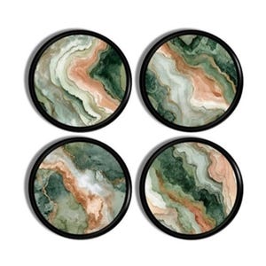 May include: Set of four round coasters with a black border. Each coaster features a watercolor design with shades of green, peach, and white, resembling a marbled stone pattern. These coasters are a decorative and functional addition to any home.