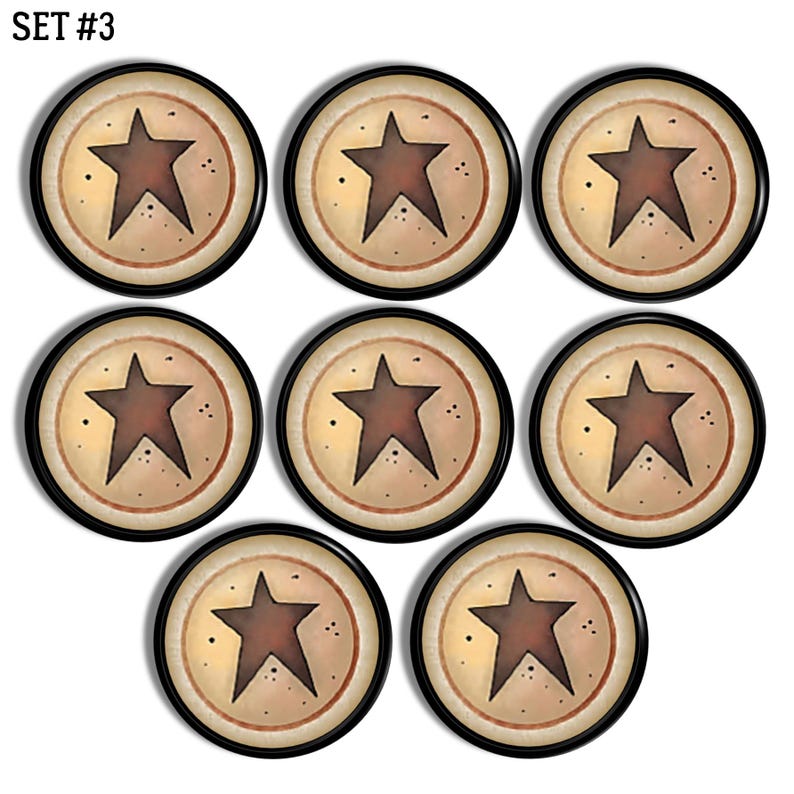 May include: A set of eight circular buttons labelled SET #3. Each button features a dark brown five-pointed star centred on a cream-coloured background with a thin brown ring border and small dark speckles surrounding the star design.
