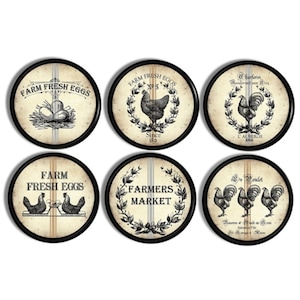May include: Six round black framed coasters with a white background and black and white illustrations of chickens and roosters. The coasters feature text that says "Farm Fresh Eggs", "Farmers Market", and "L'Auberge 1888".