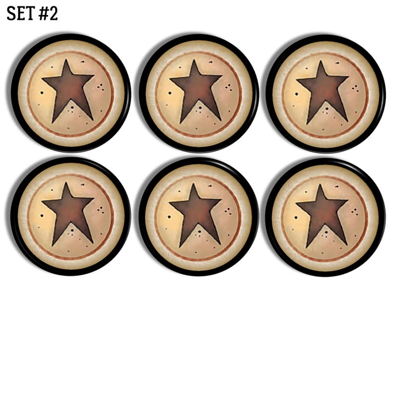 May include: A set of six circular buttons, labelled SET #2, each featuring a dark brown five-pointed star centred on a cream-coloured background with small black speckles, enclosed by a thin reddish-brown ring and a solid black outer border.