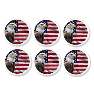 May include: Six circular white buttons displaying a bald eagle set against the American flag. The eagle has a white head, yellow beak, and brown body. The flag design features red and white stripes and a blue field with white stars.