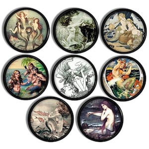May include: Set of eight round coasters featuring vintage illustrations of mermaids in various poses. The coasters are black with a white border and each features a different mermaid illustration.