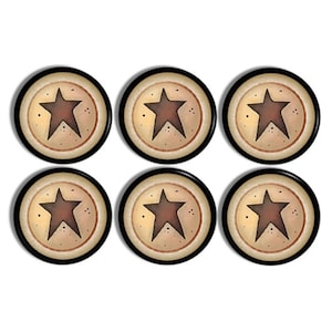 May include: Six round decorative magnets with a rustic star design. Each magnet features a brown star on a tan background, framed by a black border. The magnets are arranged in two rows of three.