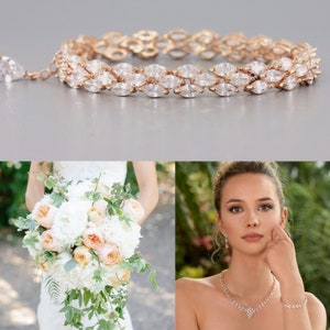 May include: A rose gold bridal bracelet with a delicate chain and marquise-shaped clear stones. The bracelet is shown on a model wearing a white dress and holding a bouquet of white and peach flowers.