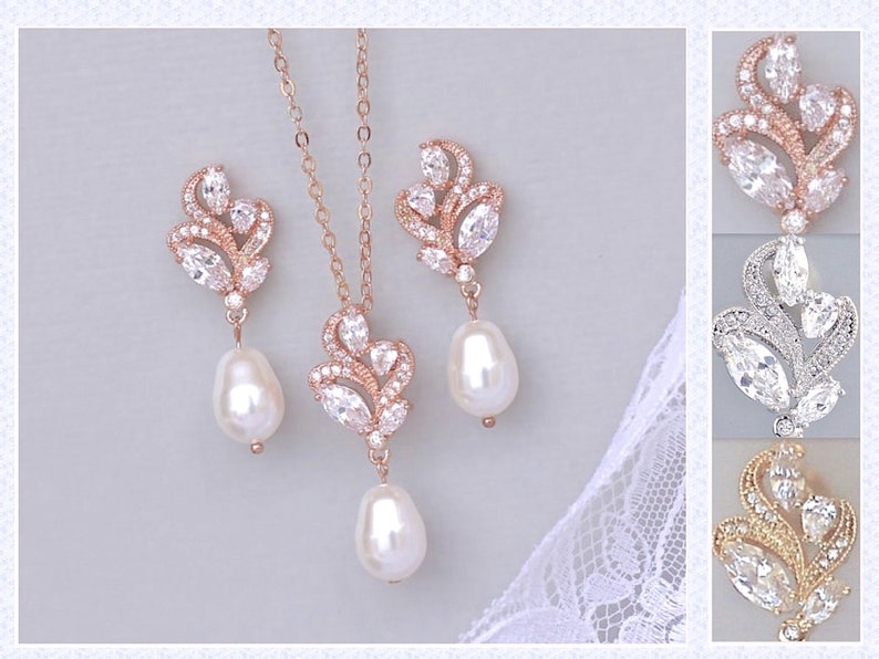 May include: A rose gold bridal necklace and earrings set with pear-shaped crystals and pearl drops. The set is available in rose gold, silver, and gold.