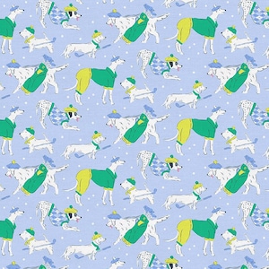 May include: A repeating pattern on a light blue background featuring various dog breeds dressed in golf attire. The dogs are wearing green jackets, yellow pants, and hats, some carrying golf bags and clubs. White polka dots are scattered throughout.