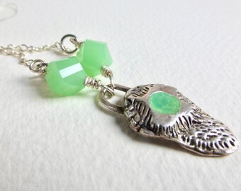 Sterling Silver Pendant with Jade Colored Resin on Sterling Silver Plated Chain.