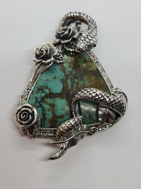 Sterling silver torquiose stone with snake and ros