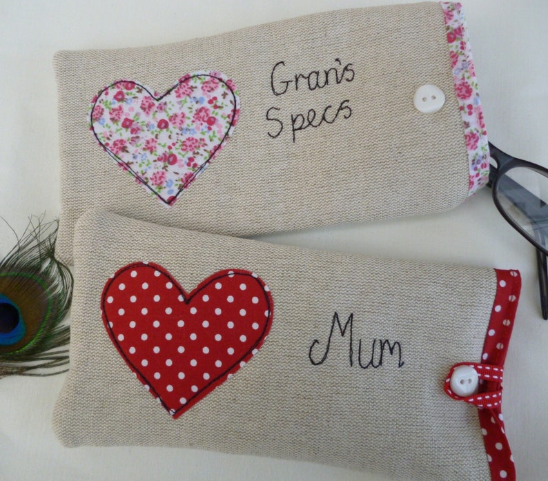 Personalised heart applique glasses case.  Spectacles or sunglasses pouch with choice of red dot or pink floral heart on linen or grey wool. coordinating ribbon and button fastening.  unique handmade customisable anniversary valentines gift