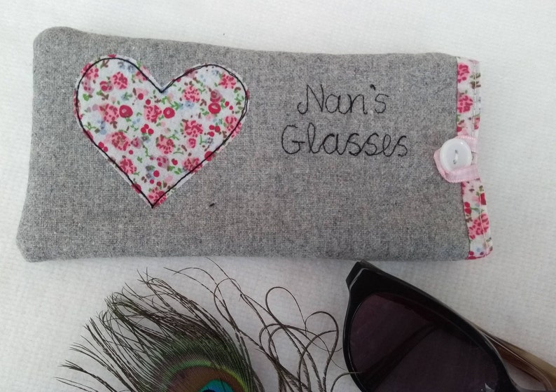 Personalised heart applique glasses case.  Spectacles or sunglasses pouch with choice of red dot or pink floral heart on linen or grey wool. coordinating ribbon and button fastening.  unique handmade customisable anniversary valentines gift