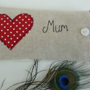 Personalised heart applique glasses case.  Spectacles or sunglasses pouch with choice of red dot or pink floral heart on linen or grey wool. coordinating ribbon and button fastening.  unique handmade customisable anniversary valentines gift