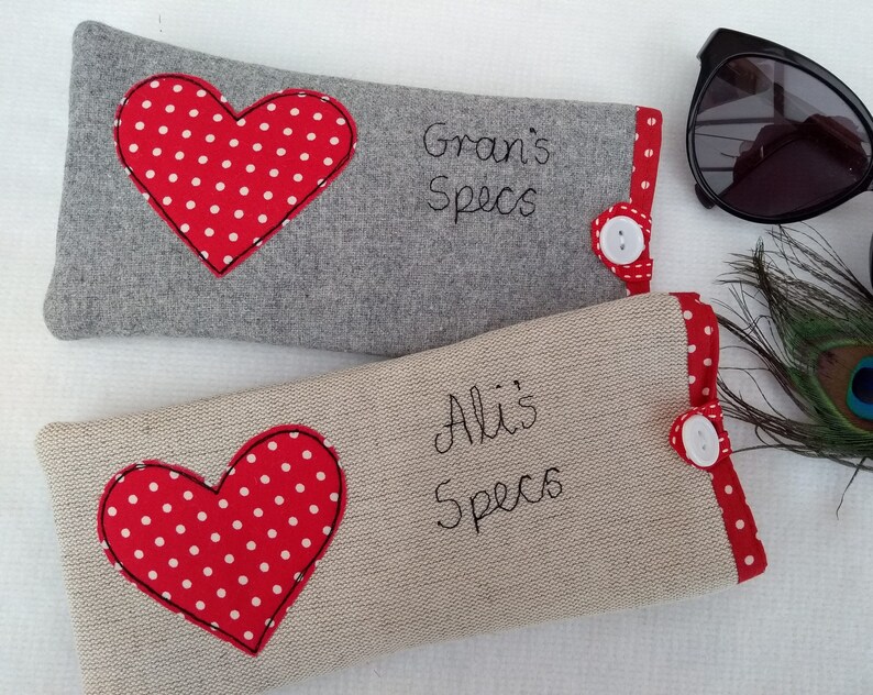 Personalised heart applique glasses case.  Spectacles or sunglasses pouch with choice of red dot or pink floral heart on linen or grey wool. coordinating ribbon and button fastening.  unique handmade customisable anniversary valentines gift