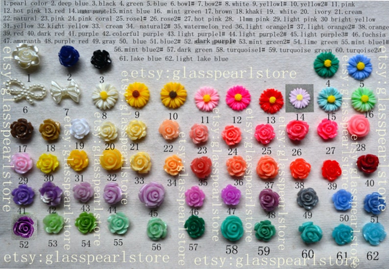 May include: An assortment of 62 colourful resin cabochons in various shapes, including flowers, bows, and roses. The cabochons are arranged in rows and numbered 1 through 62. The text "etsy:glasspearlstore" appears at the bottom of the image.
