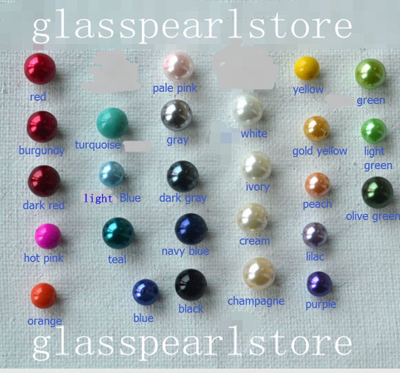 May include: Assortment of glass beads in various colors, including red, burgundy, dark red, hot pink, orange, turquoise, light blue, teal, navy blue, blue, black, pale pink, gray, dark gray, white, ivory, cream, champagne, gold yellow, light green, yellow, green, peach, lilac, and olive green. The beads are arranged in rows on a white surface. The text "glasspearlstore" appears at the top and bottom of the image.