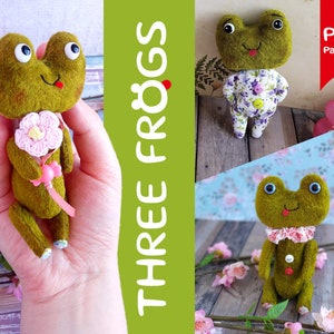 May include: Three plush frog toys with green bodies and white eyes. One frog is holding a pink flower, another is wearing a floral dress, and the third is wearing a pink and white collar. The image includes the text "THREE FROGS" and "PDF Pattern".