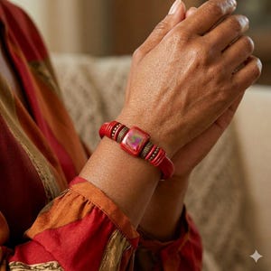 May include: A handmade, wooden sign with the text "Welcome" in a handwritten style. The sign is painted white with a distressed finish, and a small, green plant is attached to the bottom. The sign is designed for indoor or outdoor use.