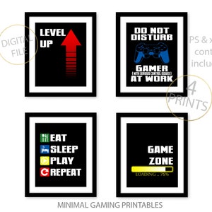 May include: Four printable posters with a gaming theme. The posters have black backgrounds with white text and graphics. The posters feature the text "Level Up", "Do Not Disturb Gamer At Work", "Eat Sleep Play Repeat", and "Game Zone Loading 75%".