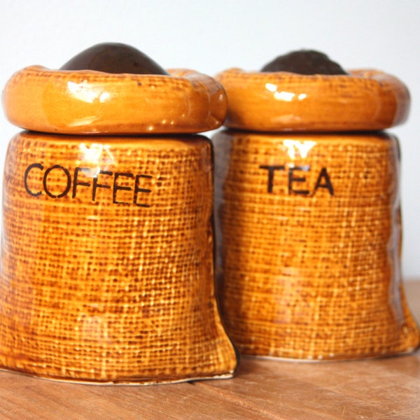 A pair of tea and coffee caddies in the form of ceramic burlap sacks.