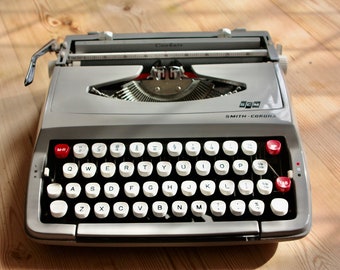 A Smith-Corona Corsair typewriter in grey.
