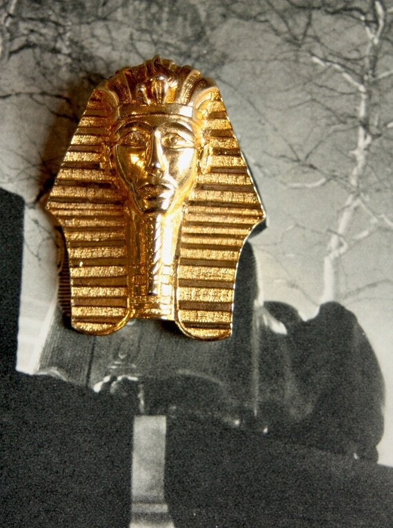 A gold plated Tutankhamun brooch designed by Adria