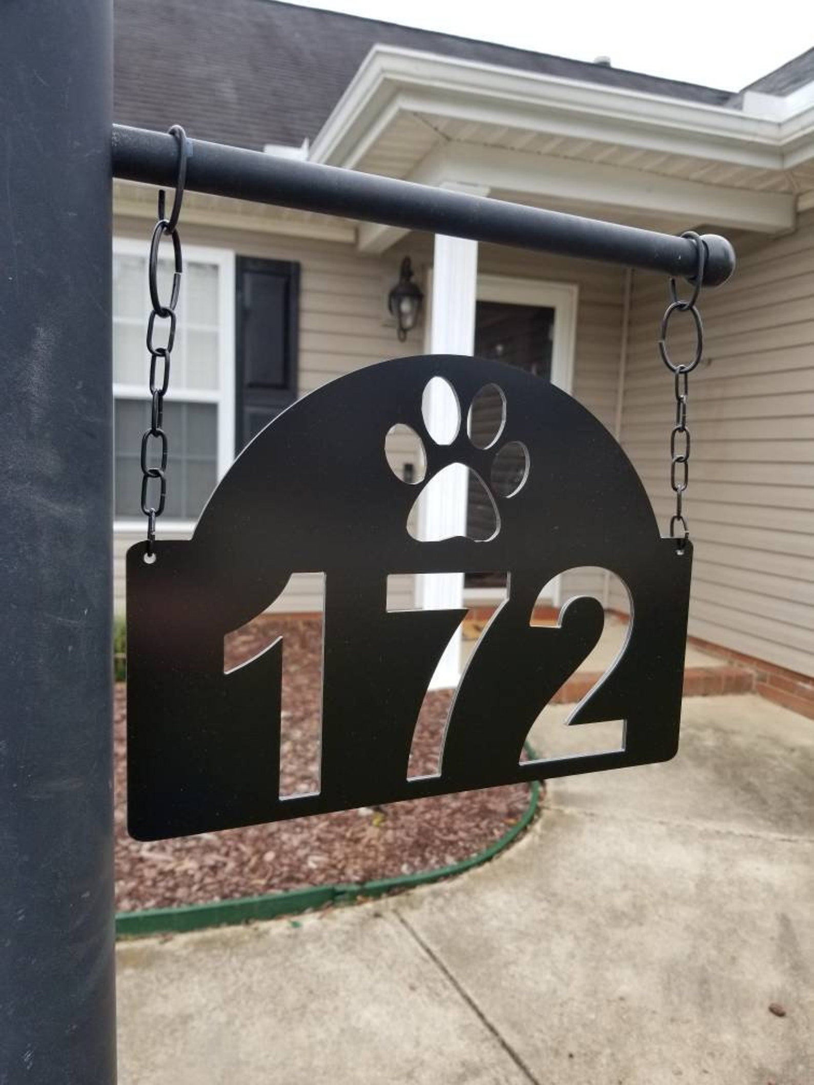 white lamp post with address sign
