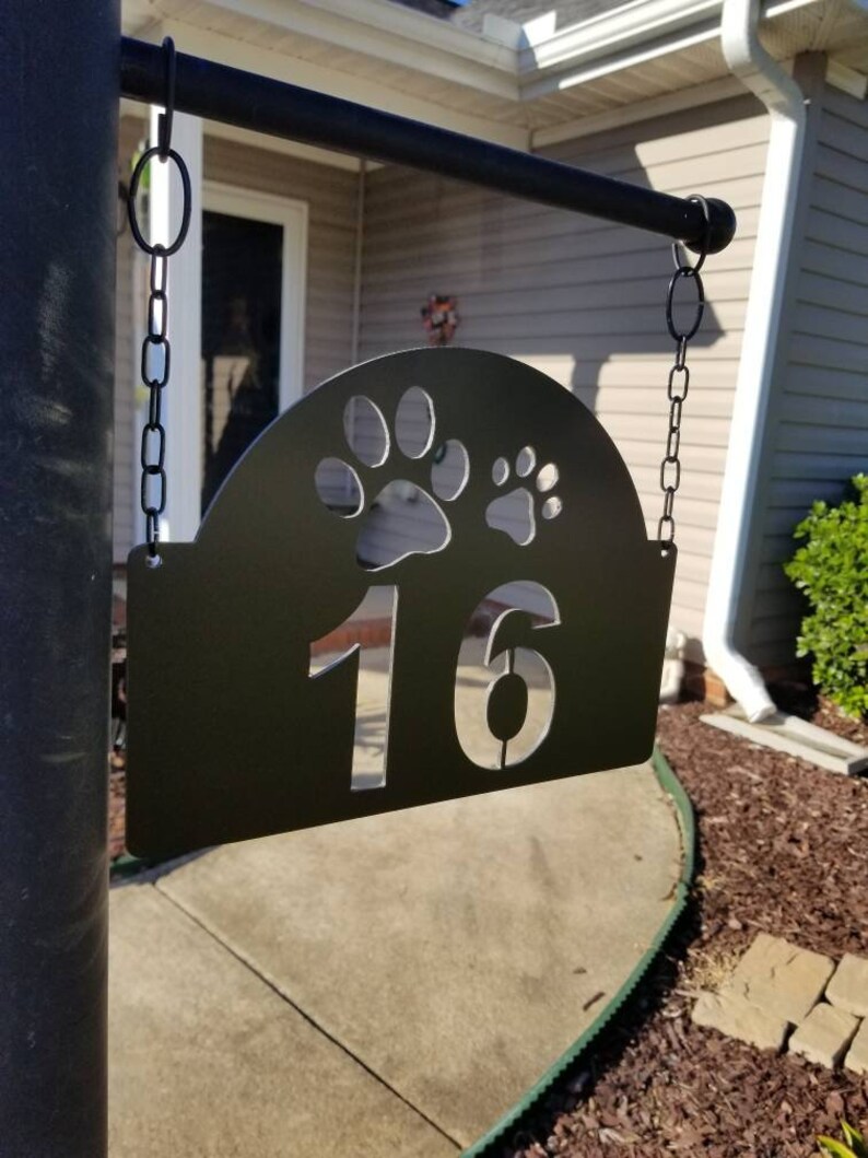 white lamp post with address sign