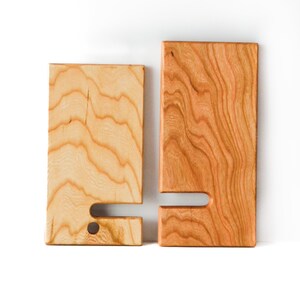 Two Tone Cherry wooden cell phone stand. The two pieces are separated to show how they fit together and how the stand easily collapses for easy travel or carrying.