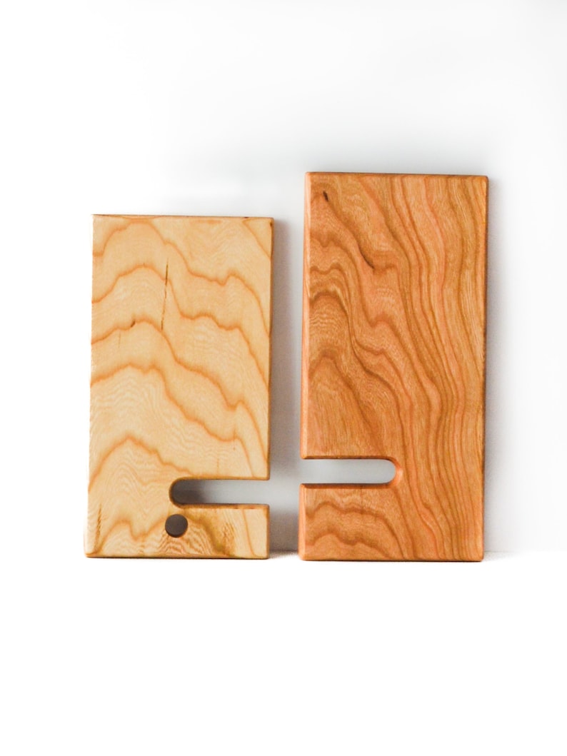 Two Tone Cherry wooden cell phone stand. The two pieces are separated to show how they fit together and how the stand easily collapses for easy travel or carrying.