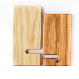 Two Tone Ash wooden cell phone stand. The two pieces are separated to show how they fit together and how the stand easily collapses for easy travel or carrying.