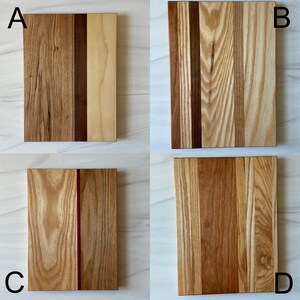 Image of options A, B, C and D.
A - 3 stripes Medium, Dark, Light woods.
B - 6 stripes of various woods most in light tones.
C - 3 stripes Oak; Purple hear (skinny); Butternut
D - 4 stripes all in various medium tone woods.