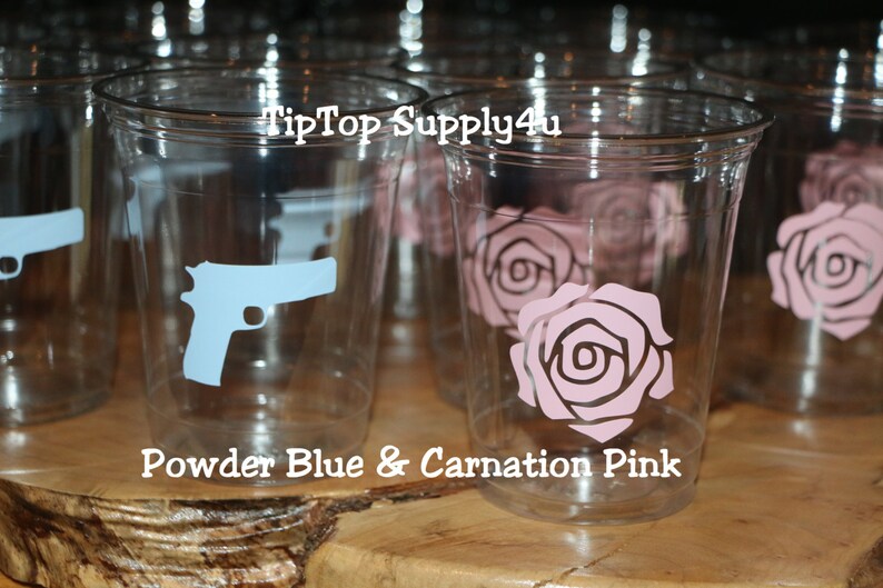 May include: Clear plastic cups with blue gun and pink rose designs. The cups are labeled "TipTop Supply4u" and "Powder Blue & Carnation Pink".
