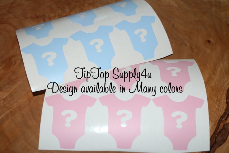 May include: Two sheets of stickers with baby onesies printed on them. The onesies are blue and pink with a white question mark in the center. The text "Tip Top Supply 4u" and "Design available in Many colors" is printed on the sheets.