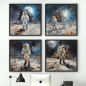 May include: Four framed paintings of astronauts on the moon, hanging on a white wall above a desk with two white office chairs. The paintings are in a painterly style with a dark background and a bright moon.