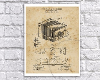 May include: A vintage patent drawing for a photographic camera, dated 28 March 1893. The drawing shows a detailed illustration of the camera's design, including its internal mechanisms and external features. The patent is titled "Photographic Camera" and is attributed to J.M. Tracy and G.S. Hodges.
